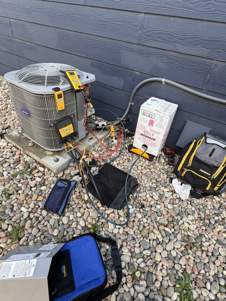 HVAC technician performing air conditioner repair to fix common AC problems and restore cooling efficiency