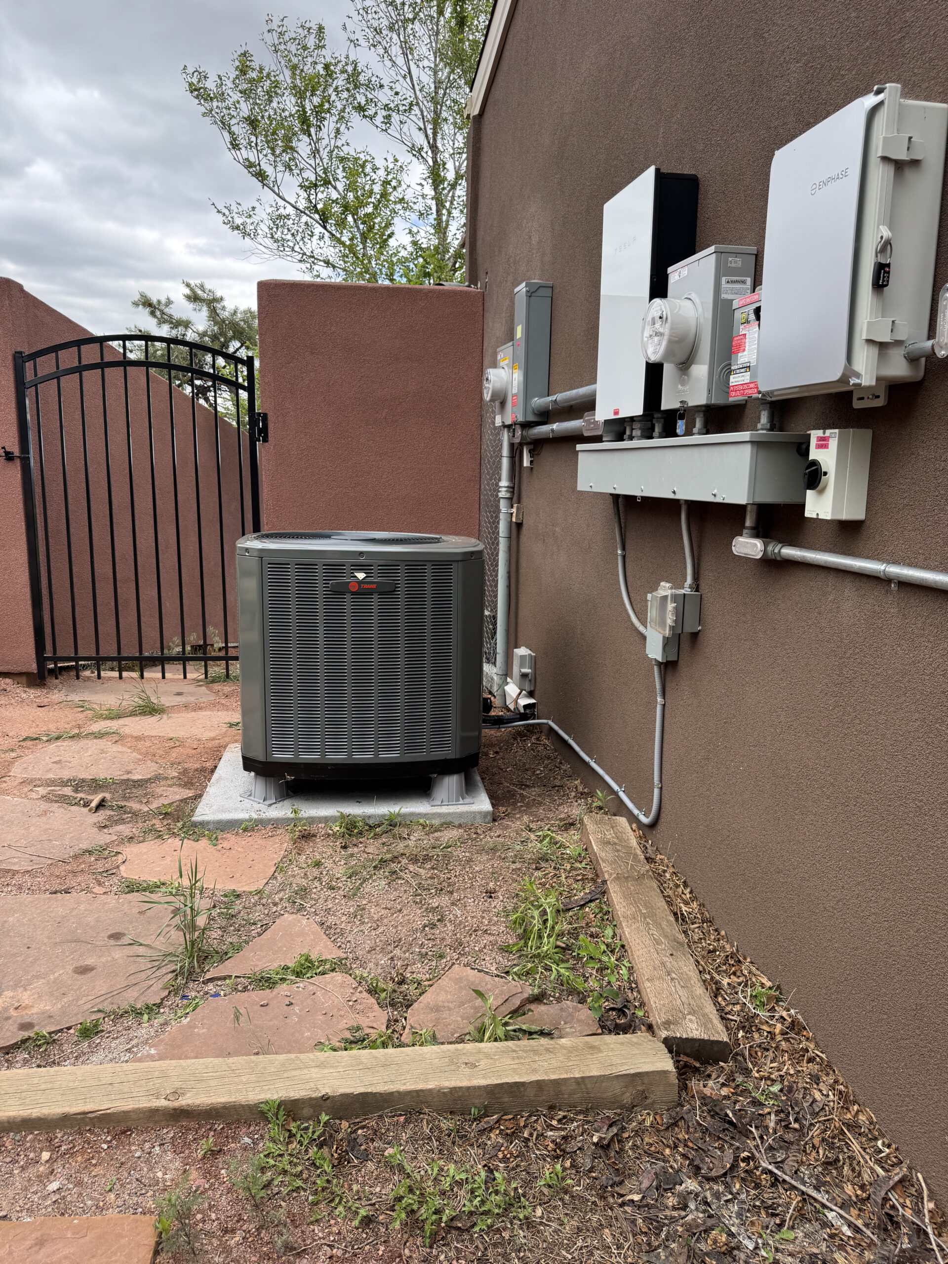 Homeowner discussing new air conditioning system installation with an HVAC professional for better comfort and efficiency